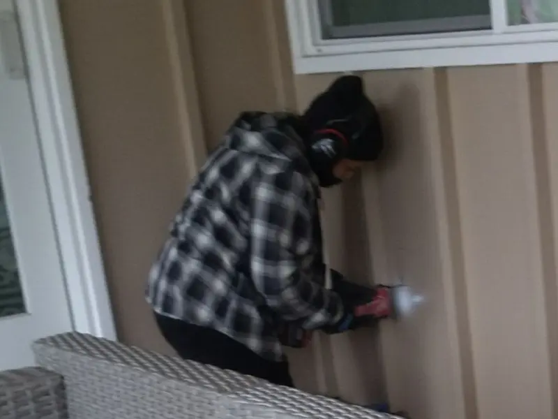 Professional electrician installing an exterior outlet in Sonterra