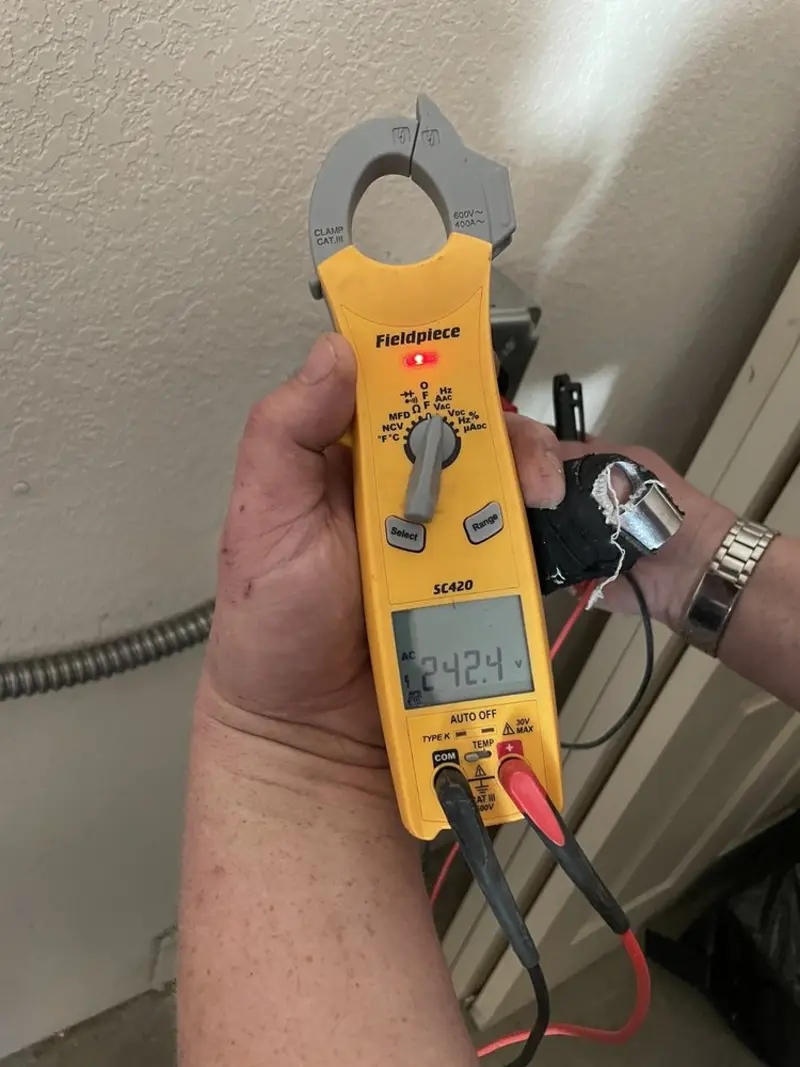 Voltage testing with clamp meter during Ceiling Fan Installation in Sonterra